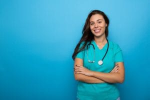 portrait of a young nurse wearing scrubs and a friendly smile