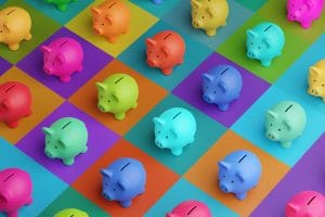 array of piggy banks in saturated colours on high colour contrast background. illustration of the concept of bank savings, financial investment and multiple sources of income